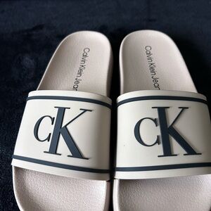 Calvin Klein Jeans Tan Slide Sandals with Black CK Logo